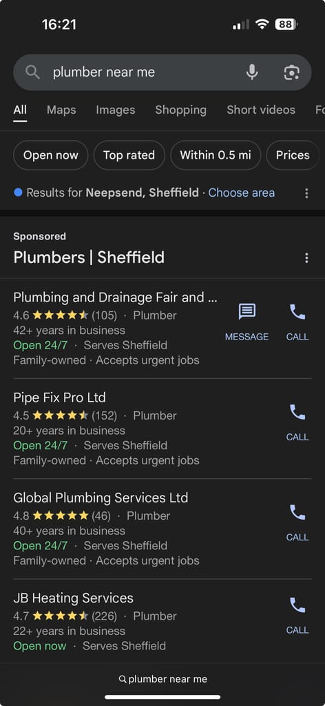 A screenshot of local service ad results for "plumber near me" searched on mobile
