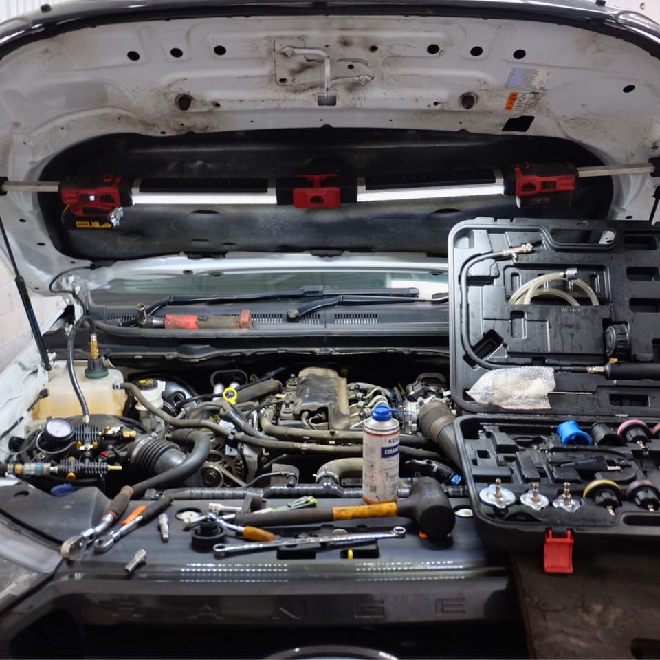open bonnet in mechanics shop MB Services